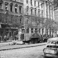 Ferenc körút, szemben a 46-os szám az Üllői út sarkán. A sineken egy szovjet BTR-152 páncélozott lövészszállító jármű roncsa.