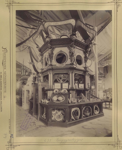 "Millenniumi kiállítás: Ruggyantagyár termékei. A felvétel 1896-ban készült." A kép forrását kérjük így adja meg: Fortepan / Budapest Főváros Levéltára. Levéltári jelzet: HU.BFL.XV.19.d.1.10.151
