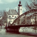 Kettős híd a Rábán a Bécsi kapu tér és a Radó sziget között, háttérben a Karmelita templom.