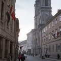 Fő (Március 15.) utca, szemben a Nepomuki Szent János-templom és rendház.